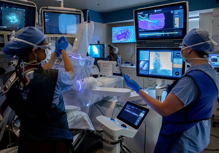 Doctor performing robotic Bronchoscopy.